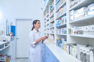 At work. Female pharmacist working in a drugstore